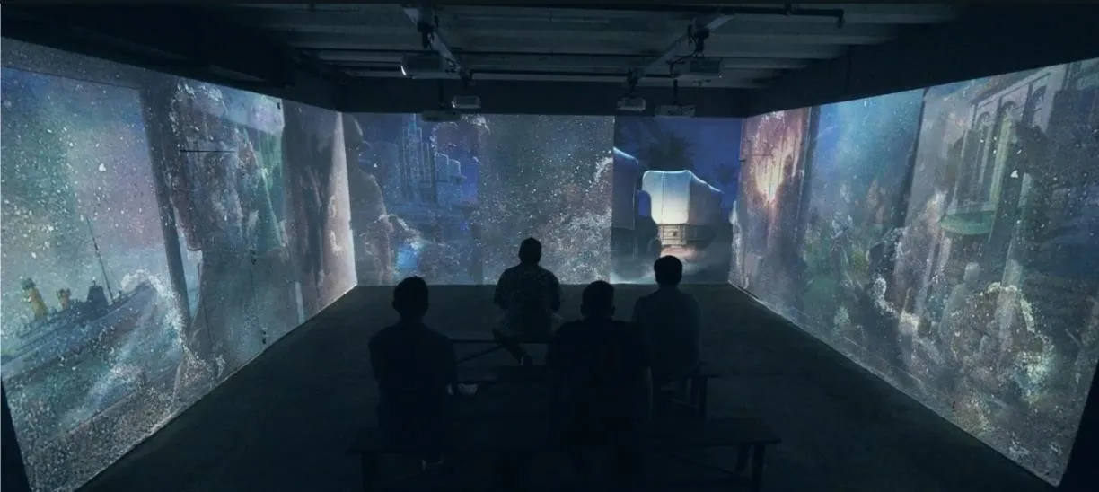 Visitors seated in the 270-degree projection room at BattleBox