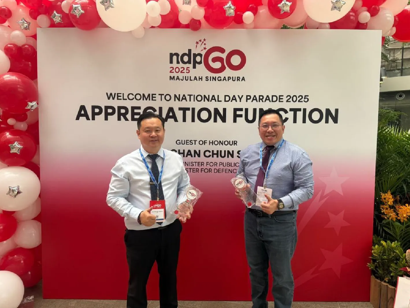 Two PushButton Consortium representatives at the National Day Parade 2025 Appreciation Function