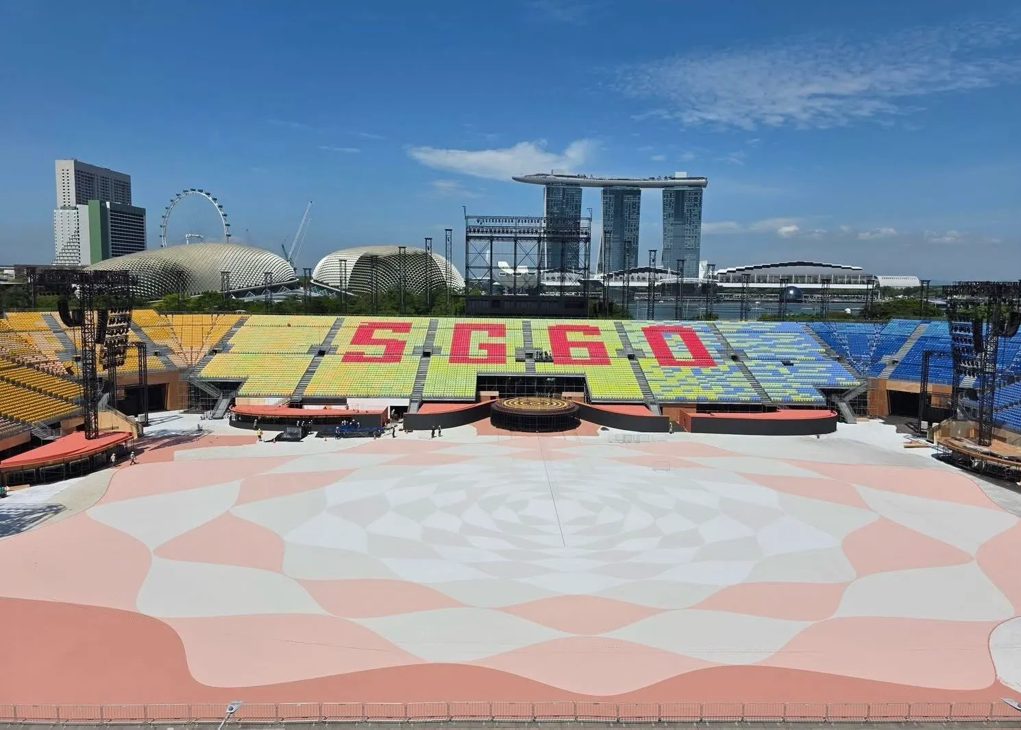 The National Day Parade 2025 show floor and stands, with Marina Bay Sands and the Esplanade behind