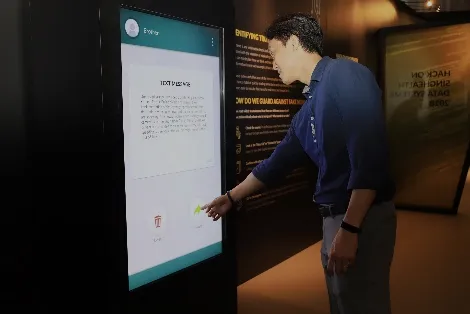 Visitor using a touchscreen quiz