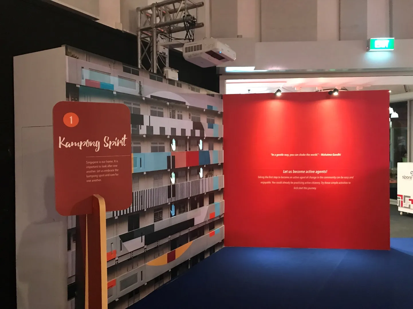 Kampong Spirit display beside a red feature wall